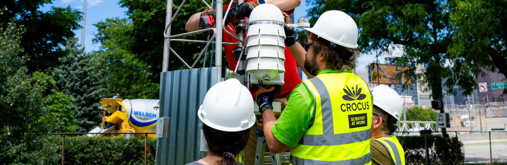 A group of CROCUS researchers install a waggle node.